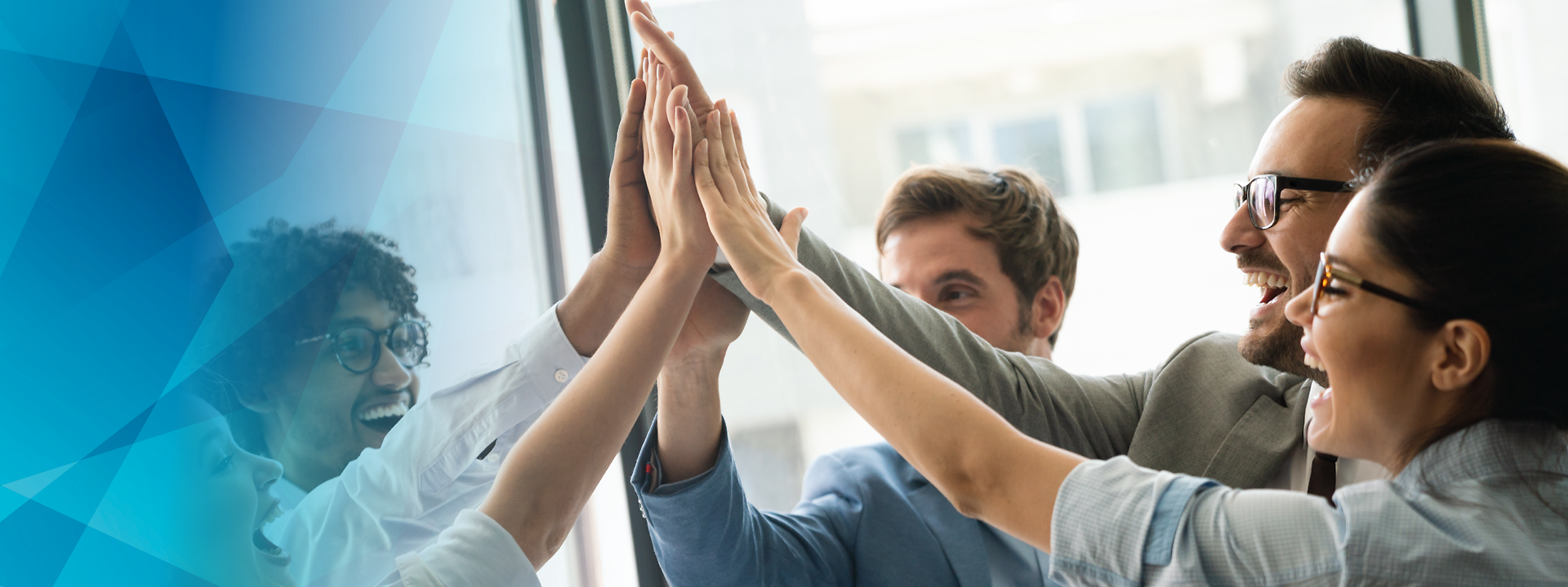 Several people, high-fiving each other