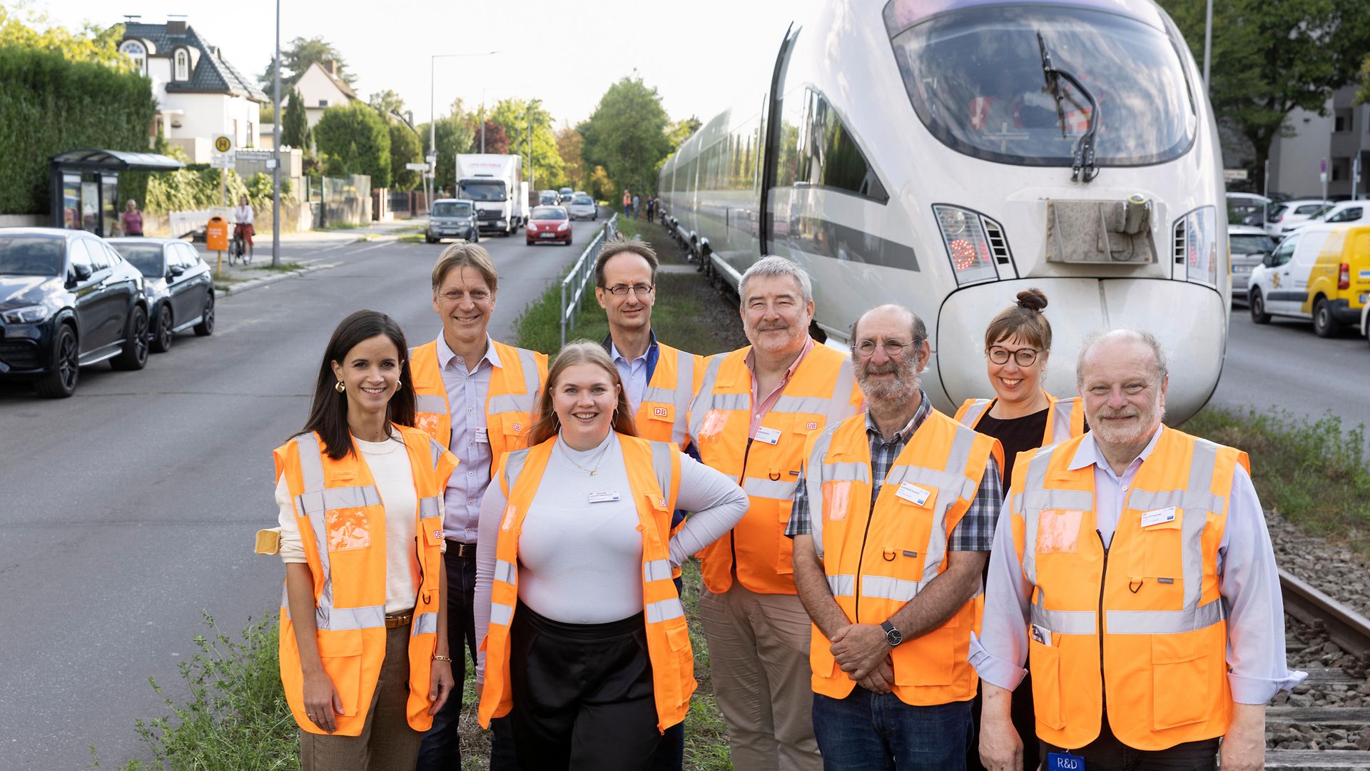 The DB Systel research management team in front of an ICE train
