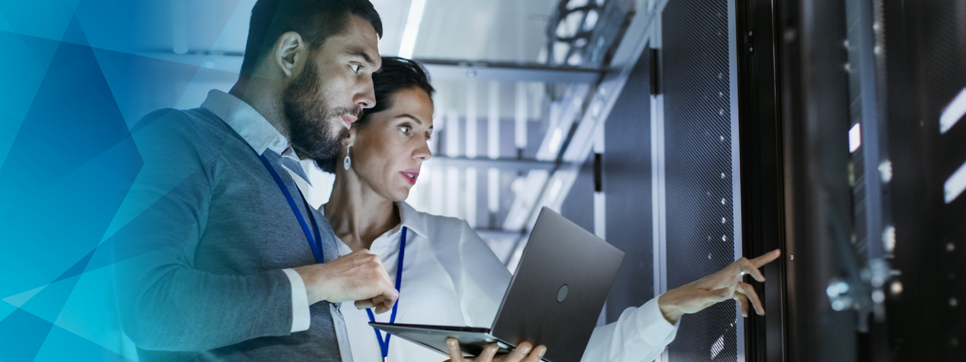 Man and woman with laptop in business outfit